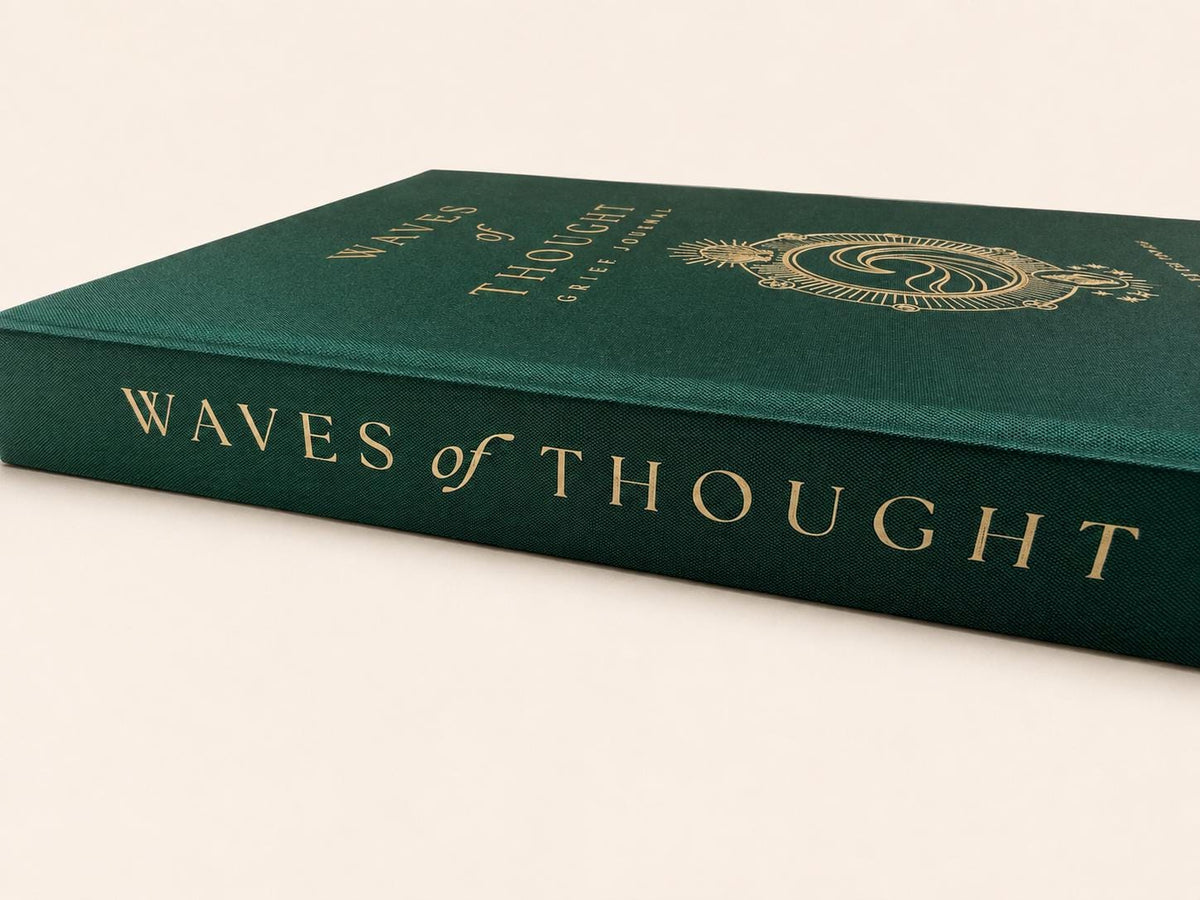 Close up of the gold foil page edges and linen texture on the Waves of Thought bereavement journal