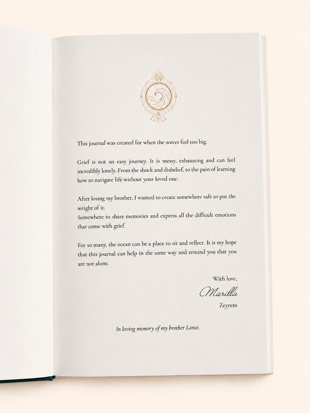 Hand holding the Waves of Thought grief journal, A5 size with 258 pages and gold foil edges