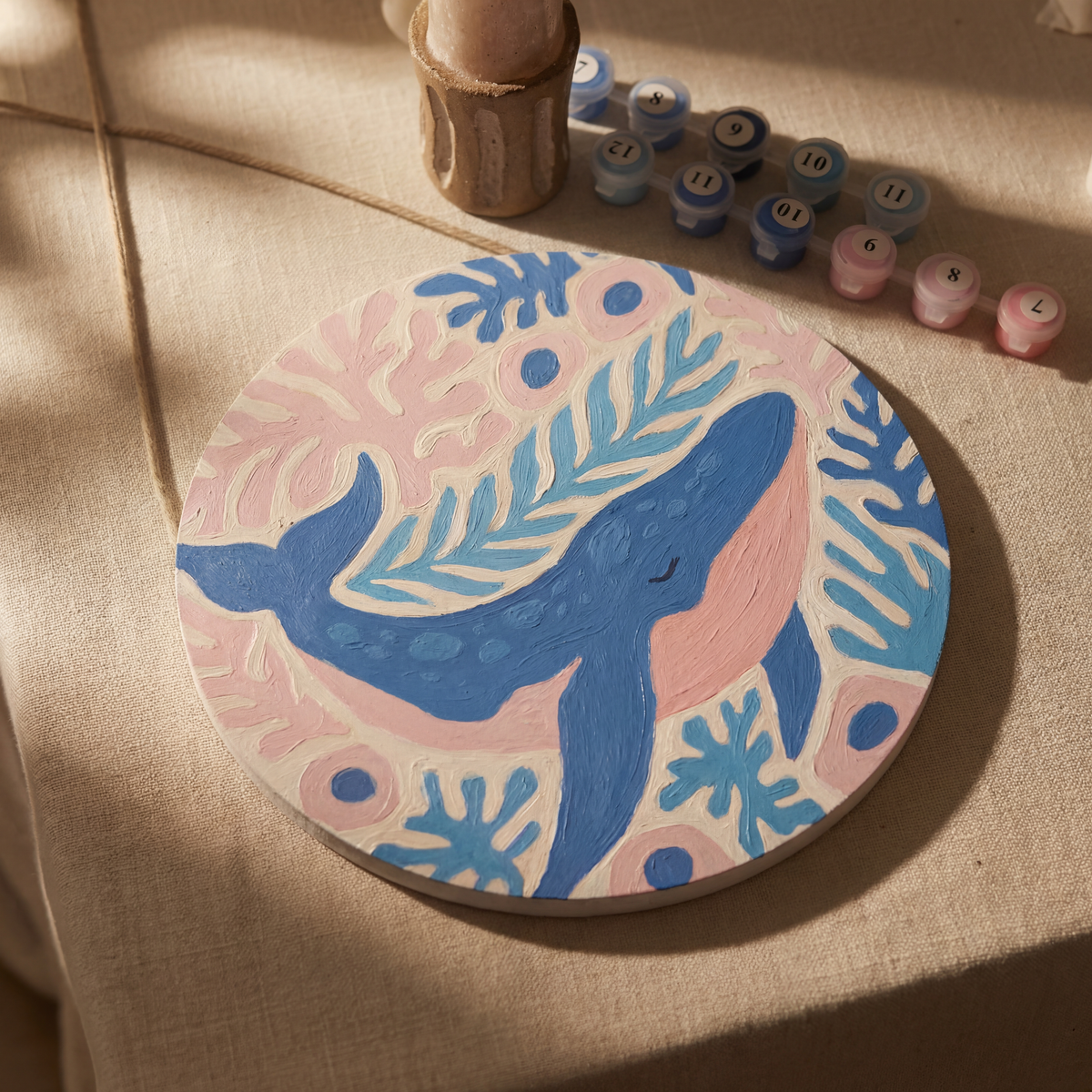 Ocean paint by numbers canvas painted in soft blues and pinks showing a whale, from the Zeyrem art therapy grief care package